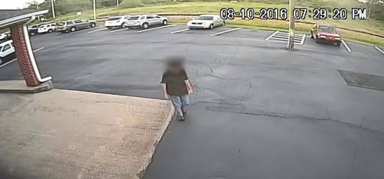 This is believed to be a photo of the man outside the church. Police have not identified him yet. (Surveillance photo)