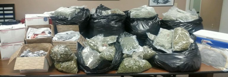 Huntsville Police show the drugs and cash confiscated in this bust. (Photo: Huntsville Police Department)