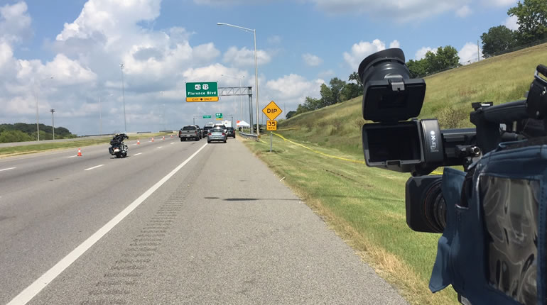 Police are investigation something off the side of Helton Drive, just near the exit to Florence Blvd. on the northbound side. (Photo: Carter Watkins/WHNT News 19)