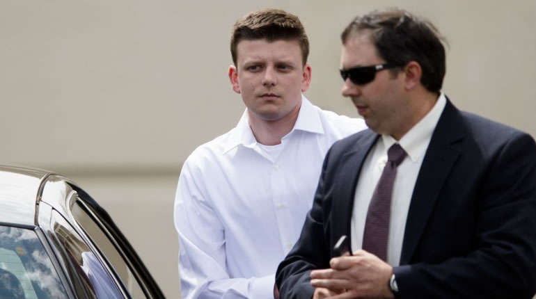 Aaron Smith, in the white shirt, with his lawyer (Albert Cesare/The Montgomery Advertiser via AP)