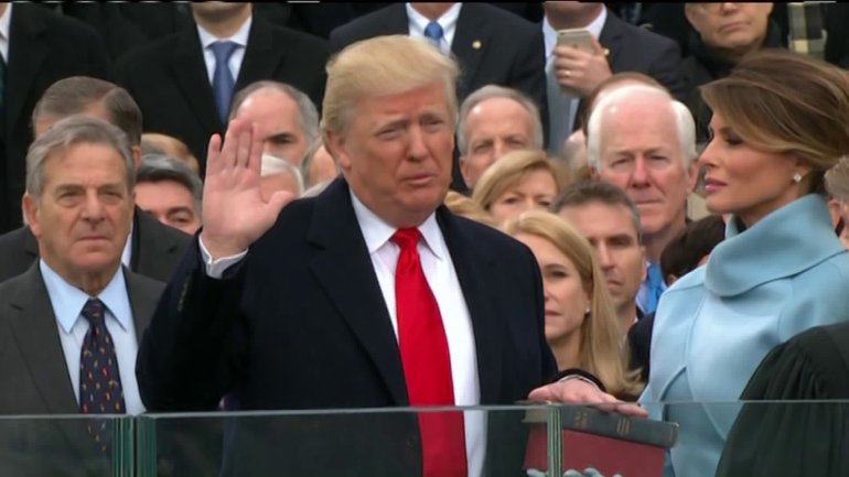 Donald Trump takes the Oath of Office to become 45th President of the United States, with his wife Melania at his side.