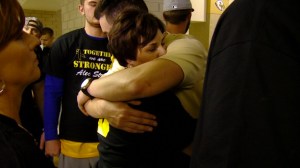 Donna Dye, Alec's mother, hugs one of the many supporters and former teammates who came to Decatur Central Saturday to pay tribute to her son.
