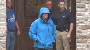 Suspended Subway spokesman Jared Fogle is seen leaving his Zionsville home as investigators conduct Tuesday's search.