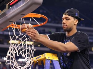 Duke Blue Devils Jahlil Okafor (15) cuts down the nets following 68-63 win over Wisconsin. The Duke Blue Devils play the Wisconsin Badgers in the NCAA Division 1 Men's Basketball Championship game Monday, April 6, 2015, evening at Lucas Oil Stadium. Matt Kryger / The Star