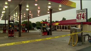 Crime scene taped off while detectives investigate shooting of gas station clerk Friday