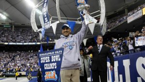 Indianapolis Colts Head Coach Tony Dungy (R) holds the Vince Lombardi Trophy to the packed crowd of fans while Colts owner Jim Irsay (R) cheer as they and their team celebrate their victory at a rally after the Colts beat the Chicago Bears in Super Bowl XLI Sunday in Miami at the RCA Dome February 5, 2006 in Indianapolis, Indiana. (Photo by Tasos Katopodis/Getty Images)