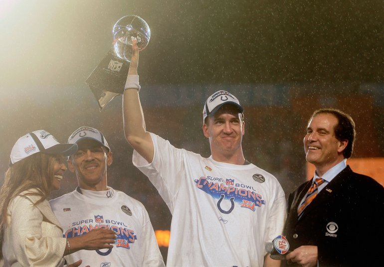 MIAMI GARDENS, FL - FEBRUARY 04: Quarterback Peyton Manning #18 of the Indianapolis Colts celebrates with the Vince Lombardi Super Bowl trophy next to head coach Tony Dungy and is wife, Lauren, and CBS sports broadcaster Jim Nantz after winning the Super Bowl XLI 29-17 over the Chicago Bears on February 4, 2007 at Dolphin Stadium in Miami Gardens, Florida. (Photo by Donald Miralle/Getty Images)