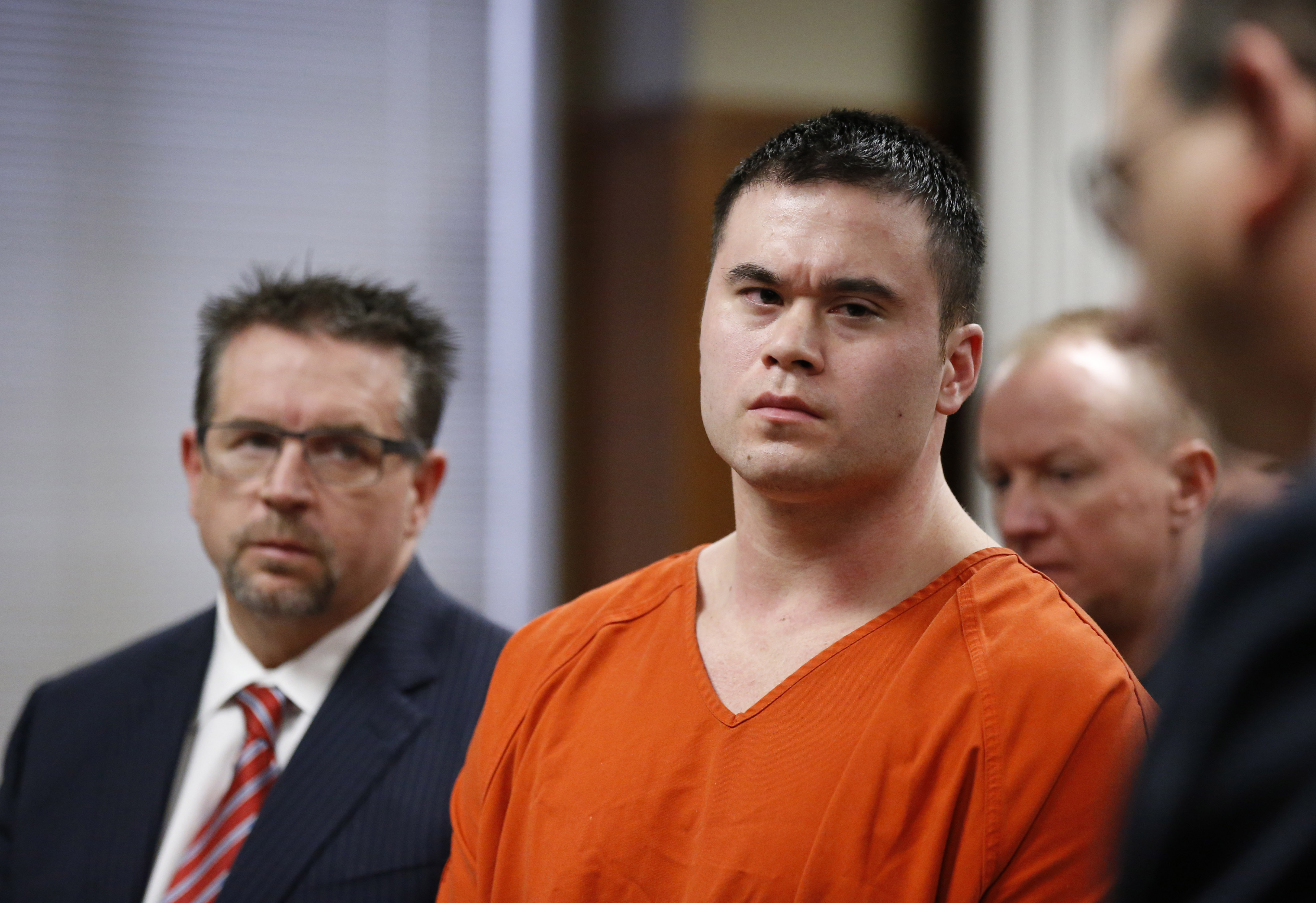 Daniel Holtzclaw,center, listens as Gayland Gieger, right, Oklahoma County assistant district attorney, speaks during Holtzclaw's sentencing hearing in Oklahoma City, Thursday, Jan. 21, 2016. At left is defense attorney Scott Adams. (AP Photo/Sue Ogrocki, Pool)