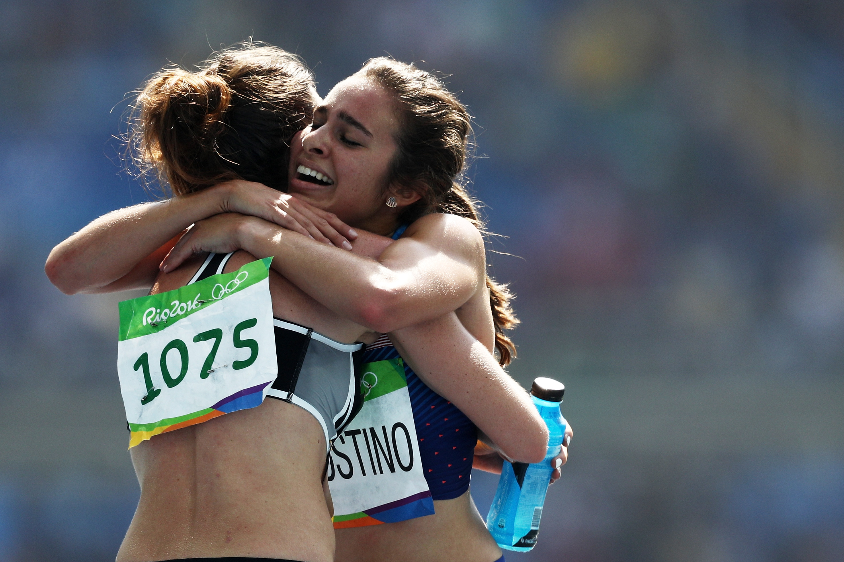 RIO DE JANEIRO, BRAZIL - AUGUST 16:  Abbey D'Agostino of the United States (R) hugs Nikki Hamblin of New Zealand after the Women's 5000m Round 1 - Heat 2 on Day 11 of the Rio 2016 Olympic Games at the Olympic Stadium on August 16, 2016 in Rio de Janeiro, Brazil.  (Photo by Patrick Smith/Getty Images)