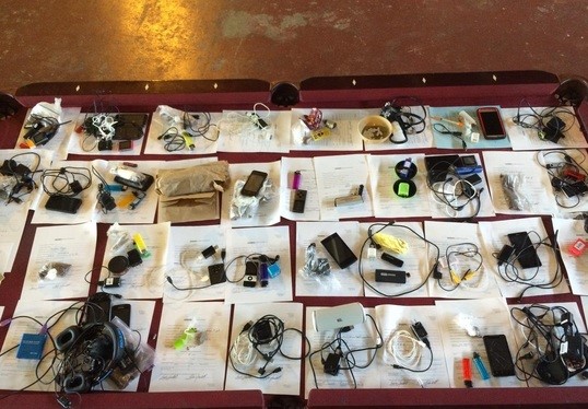 Cellphones and electronic devices seized in a contraband bust earlier this week. Courtesy: DOC