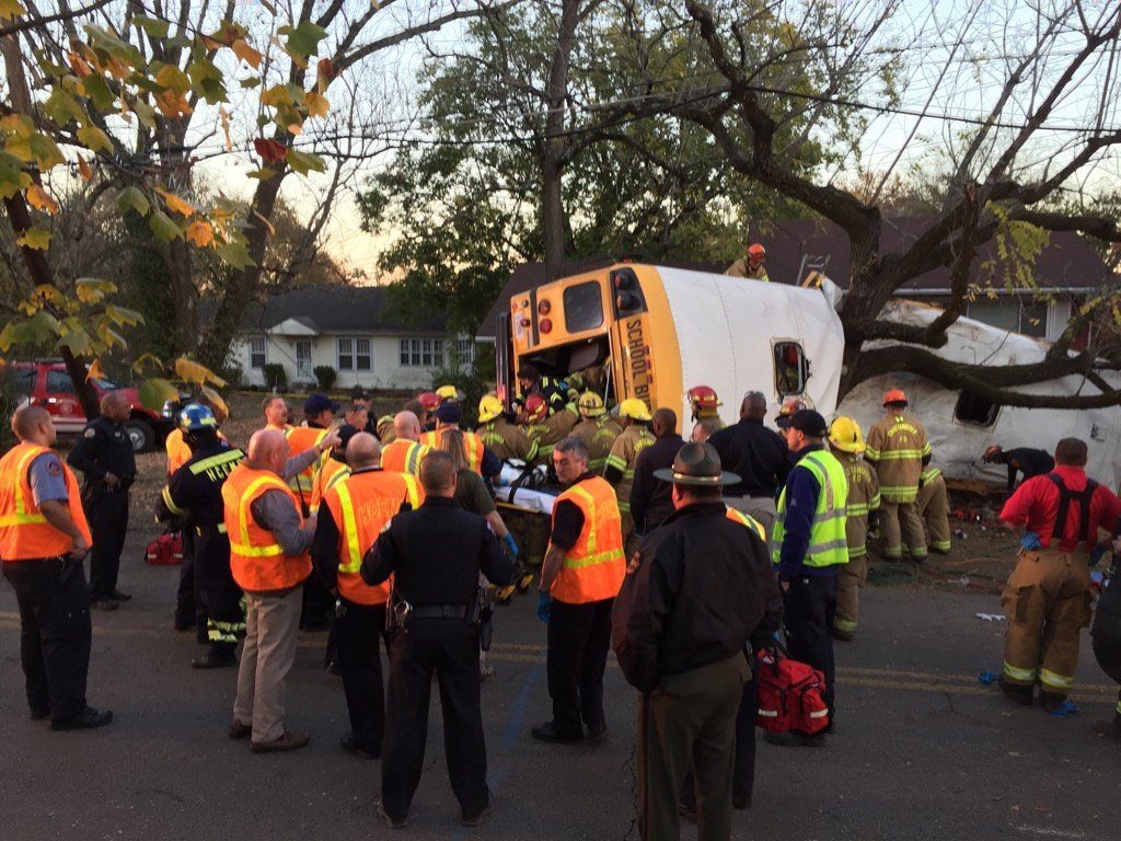 Medics rushed nearly two dozen people to hospitals in Chattanooga on Monday after a school bus crashed in the Tennessee city, officials said. The bus appears to have slammed into a tree and looks like it was split apart.