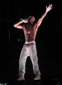 INDIO, CA - APRIL 15: A holographic image of Tupac Shakur is seen performing during day 3 of the 2012 Coachella Valley Music & Arts Festival at the Empire Polo Field on April 15, 2012 in Indio, California. (Photo by Kevin Winter/Getty Images for Coachella)