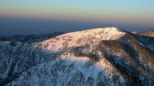 A file photo shows snow in the mountains of Southern California.