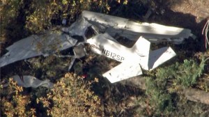 A small plane that crashed near Big Bear on Oct. 16, 2014, appeared severely damaged. (Credit: KTLA)