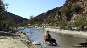 Brian Campos of Anaheim relaxes in the east fork of the San Gabriel River in the Angeles National Forest. (Credit: Francine Orr / Los Angeles Times)