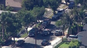 A man was taken into custody after apparently being shot by authorities during a standoff in Lawndale. (Credit: KTLA)