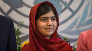 Malala Yousafzai, an education and women's rights activist, meets with United Nations Secretary General Ban Ki-Moon (not seen) on Aug. 18, 2014, in New York City. Mala also attended a conference marking the UN's Millenium Development Goals. (Credit: Andrew Burton/Getty Images)