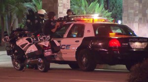 Police had guns drawn outside a Super 8 Motel in Torrance on Oct. 9, 2014. (Credit: KTLA)