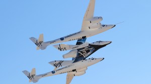 WhiteKnightTwo, carrying SpaceShipTwo, takes flight over Spaceport America, northeast of Truth Or Consequences, on October 17, 2011 in New Mexico. (Credit: FREDERIC J. BROWN/AFP/Getty Images)