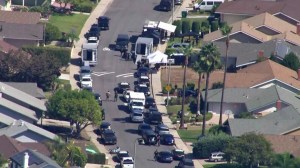 SWAT and patrol cars were outside the Avenida Calidad address given out by Jason "Mayhem" Miller, who was live-tweeting the response, on Oct. 9, 2014. (Credit: KTLA)