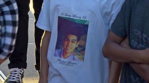 A student wears a T-short memorializing Irvine crash victim Brandon Moreno at a vigil at Carl Hankey K-8 School on Oct. 7, 2014. (Credit: KTLA)