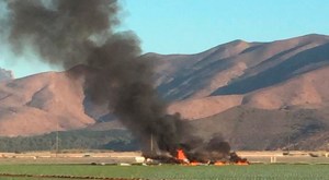 One person was killed Wednesday when a military aircraft crashed in a field near Point Mugu Naval Air Station. (Credit: Brian Rivera)