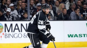 Slava Voynov #26 of the Los Angeles Kings starts a rush during the game against the San Jose Sharks at Staples Center on Oct. 8, 2014. (Credit: Harry How/Getty Images)