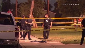 LAPD officers were investigating after five people shot in two separate shootings that occurred within an hour of each in Watts on Oct. 26, 2014. (Credit: Loudlabs)
