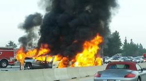 Three vehicles caught fire on the 405 Freeway on Friday, Nov. 14, 2014. (Credit: Melissa McComas)