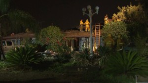 Investigators tried to determine the cause of a fire at an Arleta home that began in the morning hours of Nov. 10, 2014. (Credit: KTLA)