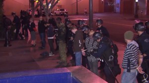 Dozens of demonstrators protesting the Ferguson grand jury's decision to not charge an officer in the shooting death of Micheal Brown were arrested on Nov. 26, 2014. (Credit: KTLA) 