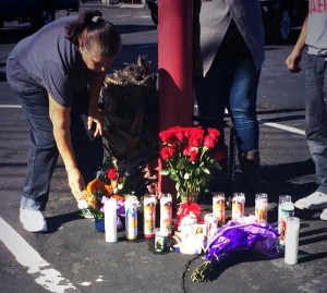 Julie Lopez is seen at a makeshift memorial for her daughter, Daniella Palacios, on Sunday, Nov. 2, 2014. Palacios was fatally struck by a hit-and-run driver in Anaheim the night before. (Credit: Mark Mester/KTLA)