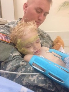 The family of a 1-year-old boy who was attacked by a dog in Riverside County on Nov. 14, 2014, provided this photo. In it the boy is seen at a Riverside County hospital with his father. 