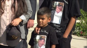 Family members are seen wearing T-shirts honoring Santos Castro at a press conference on Wednesday, Nov. 12, 2014. 