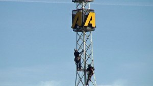 Workers climb the KTLA radio tower before its removal on Monday, Nov. 24, 2014. (Credit: KTLA)