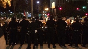 Police faced off with protesters outside LAPD headquarters in downtown Los Angeles on Nov. 25, 2014. (Credit: Nerissa Knight/KTLA)