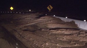 Over a foot of debris, rocks and dirt covered the Pacific Coast Highway after rainfall on Nov. 30, 2014. (Credit: KTLA)