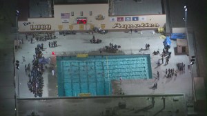 Players were in the water at Don Lugo High School in Chino after a patient was airlifted on Nov. 13, 2014. (Credit: KTLA)