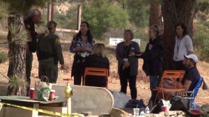 Authorities speak to supporter of James Kretzschmar, an Irvine mountain biker, near the command post for the search for him on Nov. 13, 2014. (Credit: KTLA)