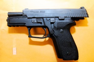 Ferguson police Officer Darren Wilson's .40-caliber Sig Sauer P229 pistol is shown in a photo presented as evidence to a grand jury weighing whether he should be indicted in the Aug. 9, 2014, killing of unarmed teen Michael Brown. (Credit: St. Louis County Prosecuting Attorney's office)