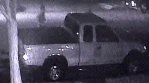 Surveillance video provided by the family shows alleged vandals approaching a truck in Huntington Beach.