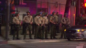 Los Angeles County sheriff's deputies await protesters near the Men's Central Jail on Nov. 26, 2014. (Credit: KTLA)