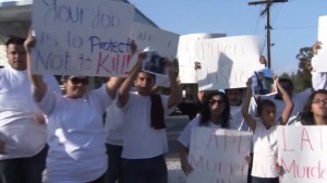 Family and friends of Josue Fuentes protested his death on Nov. 15, 2014, at a Van Nuys rally. (Credit: KTLA)