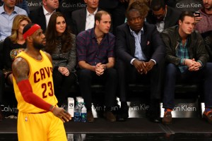 Prince William, Duke of Cambridge and Catherine, Duchess of Cambridge watch as LeBron James of the Cleveland Cavaliers looks on during his game against the Brooklyn Nets at Barclays Center on Monday, Dec. 8, 2014 in the Brooklyn borough of New York City. (Credit: Al Bello/Getty Images)