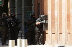 Armed policeman are seen outside Lindt Cafe on Philip St, Martin Place on Monday, Dec. 15, 2014, in Sydney, Australia. (Credit: Mark Metcalfe/Getty Images)