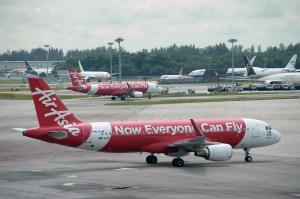 Malaysian low-cost carrier AirAsia aircraft are seen at Changi International Airport in Singapore on May 8, 2014. (Credit: Roslan Rahman/AFP/Getty Images)