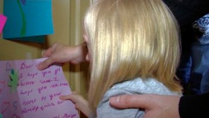 With the help of her older sisters, Shayley and Audree — who hang up the cards — cards for Addie and her sisters are pouring in from family, friends, and as word spreads on social media, even strangers.  (Credit: Sam Penrod, KLS-TV)