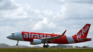 An AirAsia India Airbus A320 takes off as it embarks on the carrier's inaugural domestic flight to Goa from the Kempe Gowda International Airport (KGIA) in Bangalore on June 12, 2014. (Credit: MANJUNATH KIRAN/AFP/Getty Images)