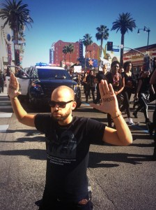 A man is seen at the #BlackOutHollywood protest in Hollywood Dec. 6, 2014. (Credit: Mark Mester/ KTLA)