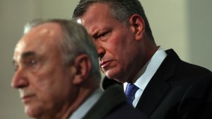 New York City Police Commissioner William J. Bratton, left, is joined by Mayor Bill de Blasio at a news conference at Woodhull Hospital following the killing of two New York City police officers on Dec. 20, 2014, in New York City. (Credit: Spencer Platt/Getty Images)